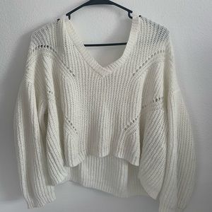 Cropped white long sleeve top